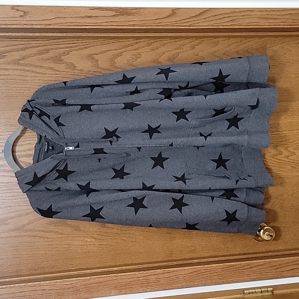 Grey zip-up hoodie with black stars